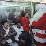 A Volunteers of America sidewalk Santa Claus on the train in 1990